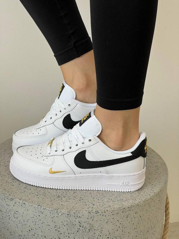 Nike air force gold swoosh best sale