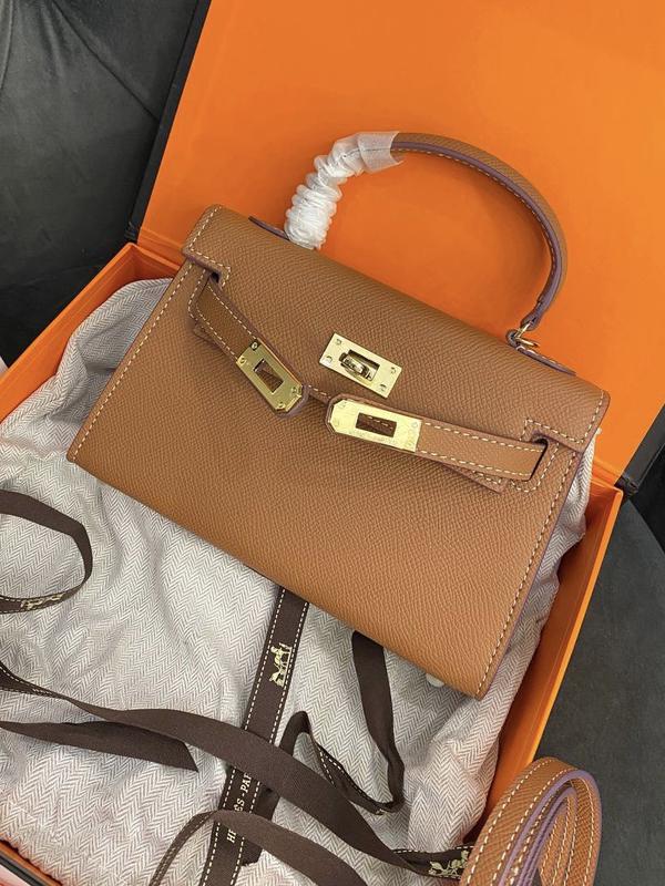 sac a main hermes lindy 34 cm en cuir togo rouge cintura Hermes Acapulco in tela nera e pelle nera mini 5400